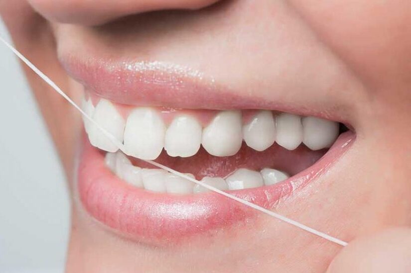 How to use dental floss without harming your teeth